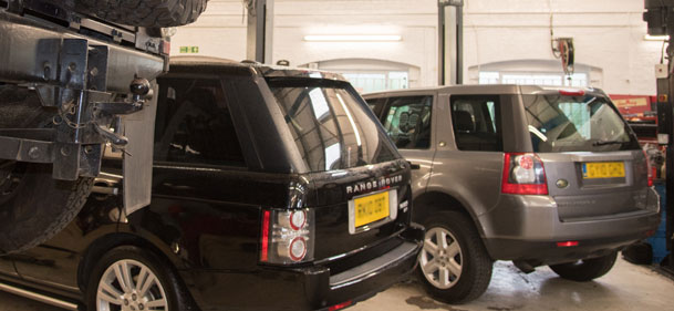 black range rover & silver land rover in kinghams lr croydon